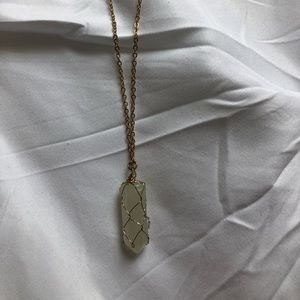 White crystal necklace with gold chain.